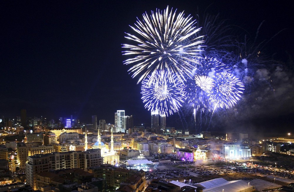 Fireworks explode during New Year's Eve celebrations in downtown Beirut
